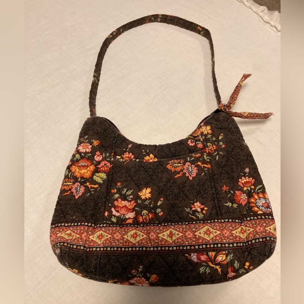 Vera Bradley small purse with multicolored print on brown background.  NWOT
